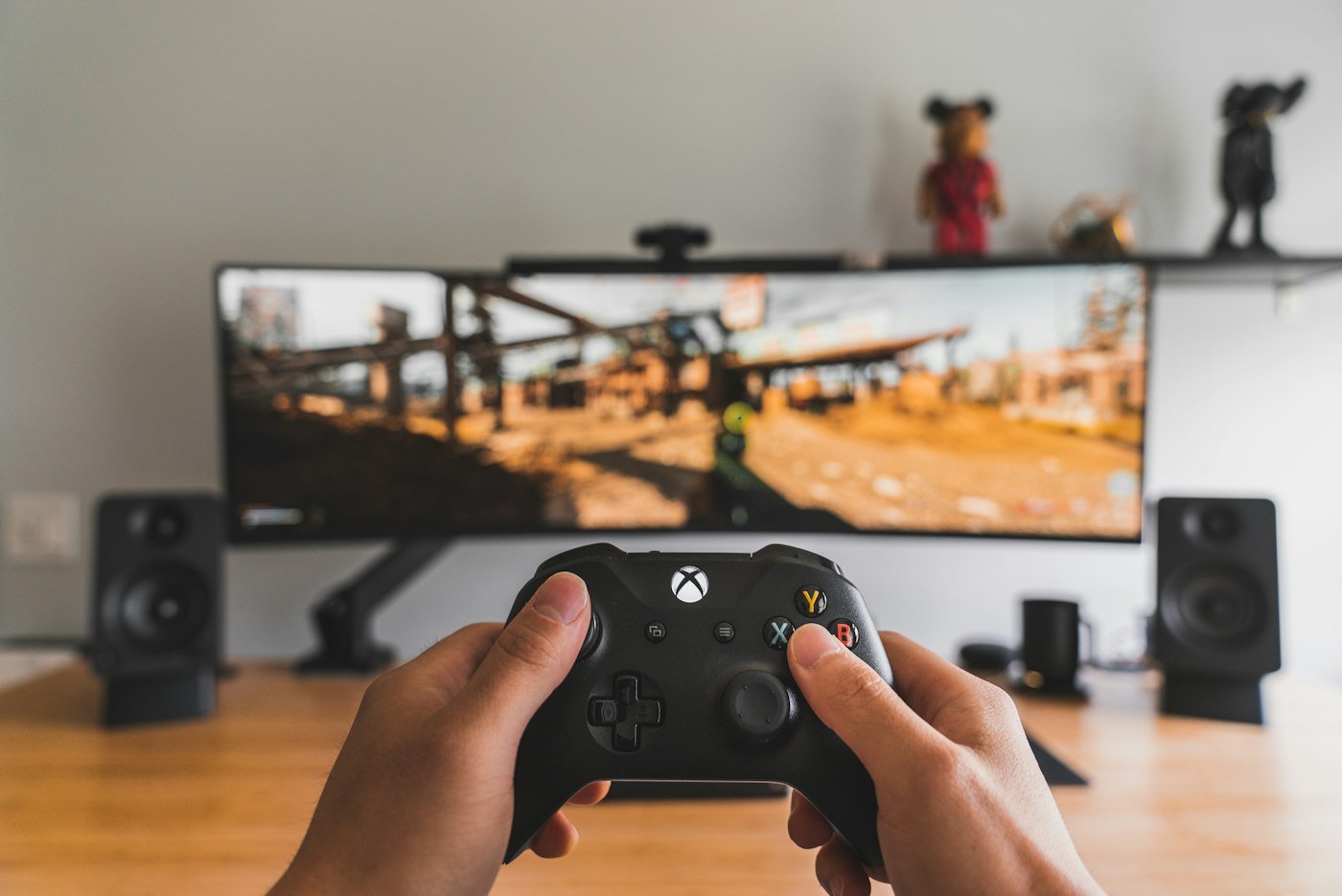 Person holding a game controller; illustrative gaming photo